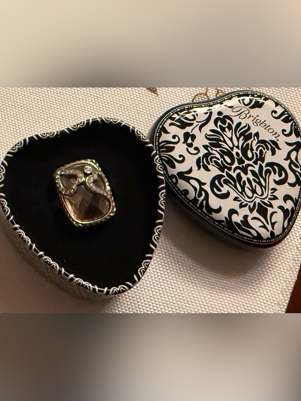 Brigitte ring with brown gemstone and silver filigree design.